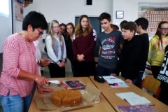 Kanishka's School principal cutting the cake with his classmates